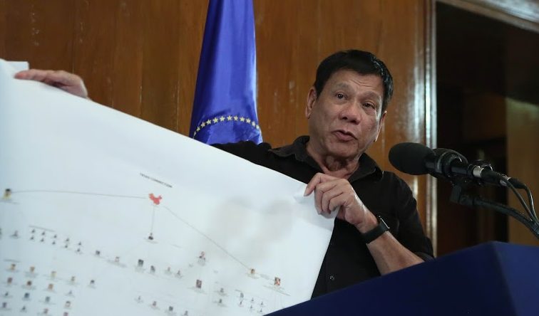 Rodrigo Duterte shows a copy of a diagram showing the connection of high level drug syndicates operating in the country c King Rodriguez
